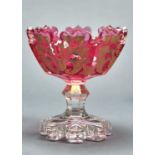 A  RUBY FLASHED AND CLEAR GLASS PEDESTAL BOWL, C1860, DECORATED IN MATT AND BURNISHED GILDING WITH