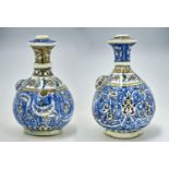 TWO ISLAMIC POTTERY KENDI, PROBABLY PERSIAN, LATE 19TH C OR LATER, OF FRIT PASTE OR SIMILAR AND OF
