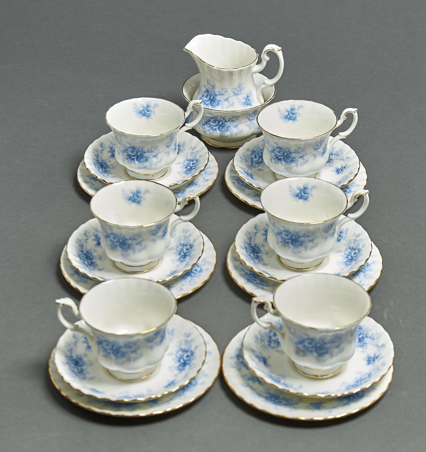 A ROYAL ALBERT WINDSOR ROSE PATTERN TEA SERVICE, COMPRISING SIX CUPS, SIX SAUCERS, SIX TEA PLATES,