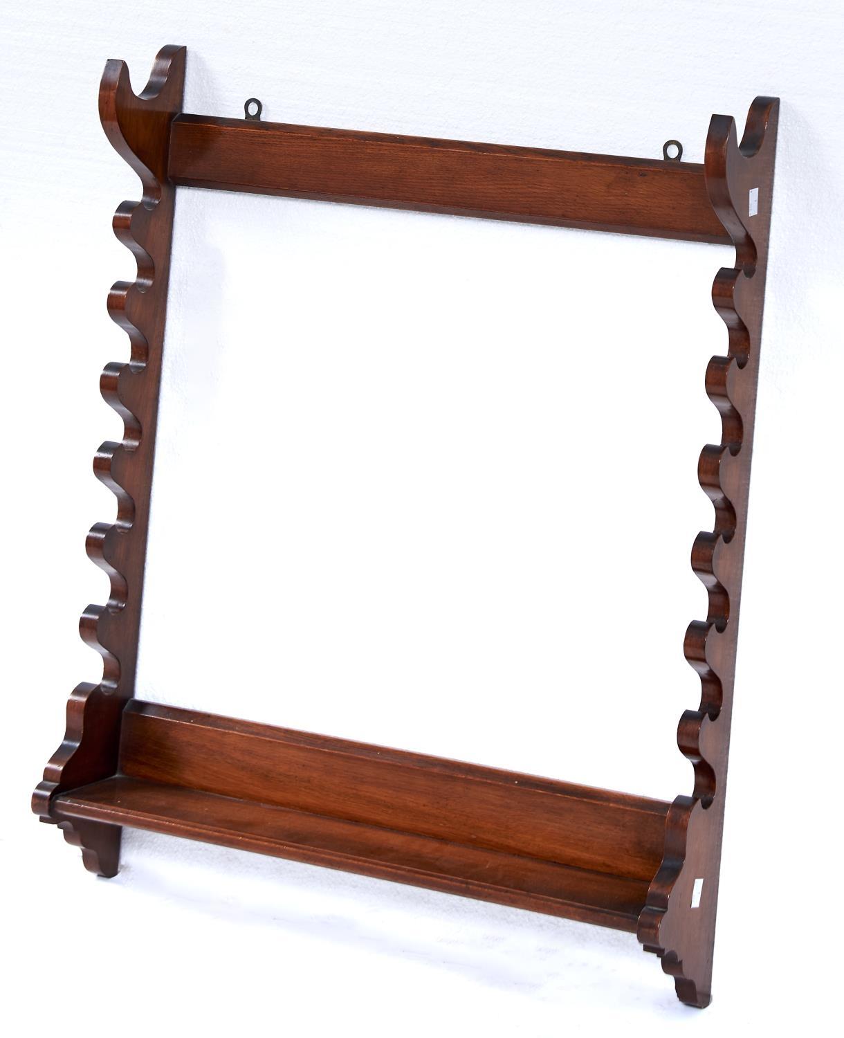 A VICTORIAN OAK WHIP RACK, C1880, THE SHAPED SIDES WITH PROVISION FOR SEVEN WHIPS WITH PLAIN