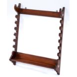 A VICTORIAN OAK WHIP RACK, C1880, THE SHAPED SIDES WITH PROVISION FOR SEVEN WHIPS WITH PLAIN