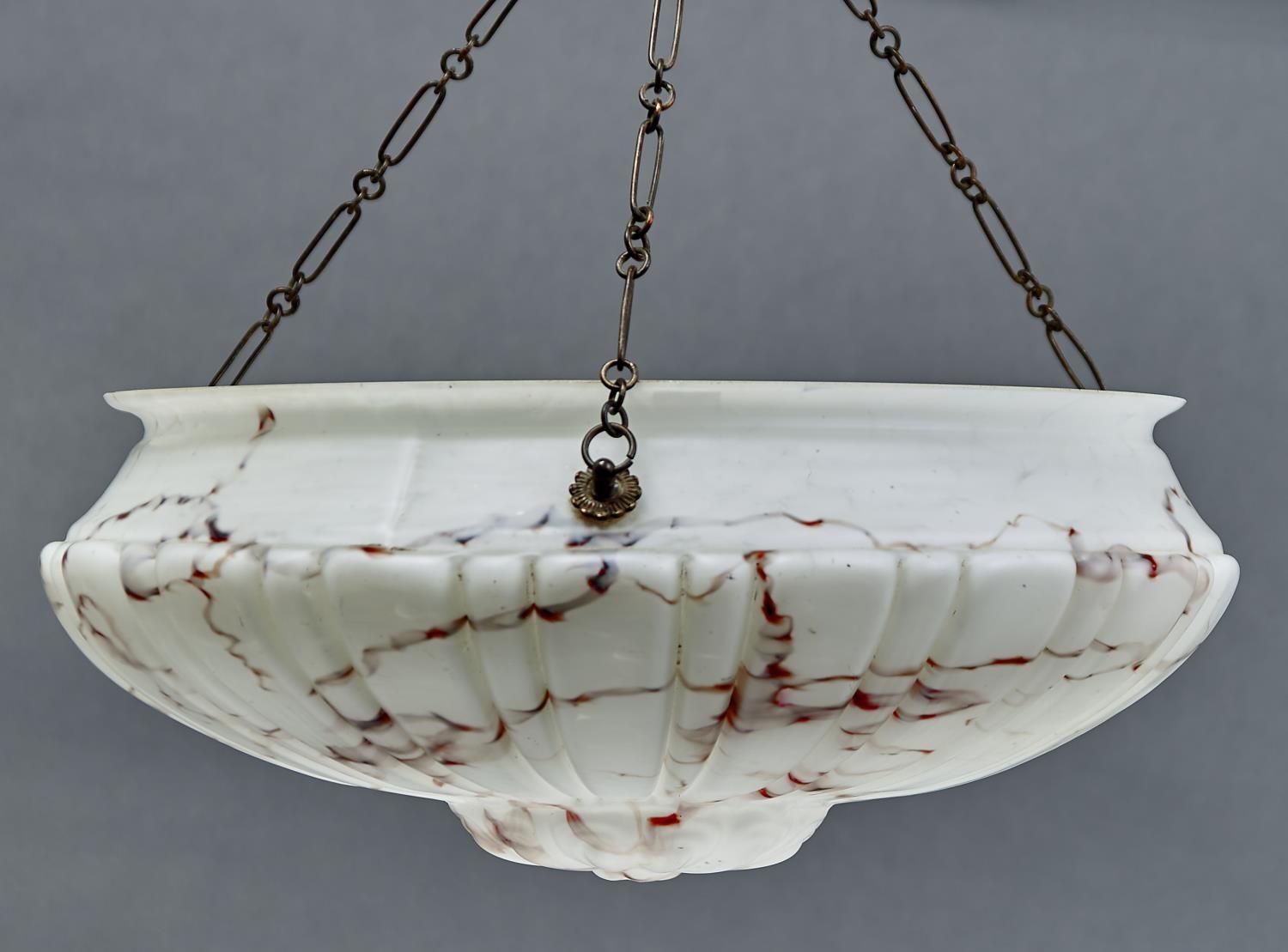 A MARBLED GLASS HANGING LIGHTSHADE, C1920, OF SHELL FORM AND SUSPENDED FROM THREE BRASS RINGS WITH