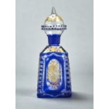 A BLUE CASED GLASS PYRAMIDAL SCENT BOTTLE AND BLOWN GLOBULAR STOPPER, LATE 19TH C, ENGRAVED AND GILT