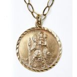 A 9CT GOLD ST CHRISTOPHER PENDANT AND NECKLACE, PENDANT 28 MM DIAMETER, MARKS OBSCURED,  12.7G Light