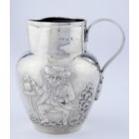 A VICTORIAN SILVER DUTCH  JUG, EMBOSSED TO EITHER SIDE WITH TOPERS,  THE REEDED HANDLE TERMINATING