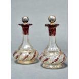 A PAIR OF BOHEMIAN RUBY FLASHED, ETCHED AND GILT GLASS SCENT BOTTLES, MID 19TH C, OF COMPRESSED,