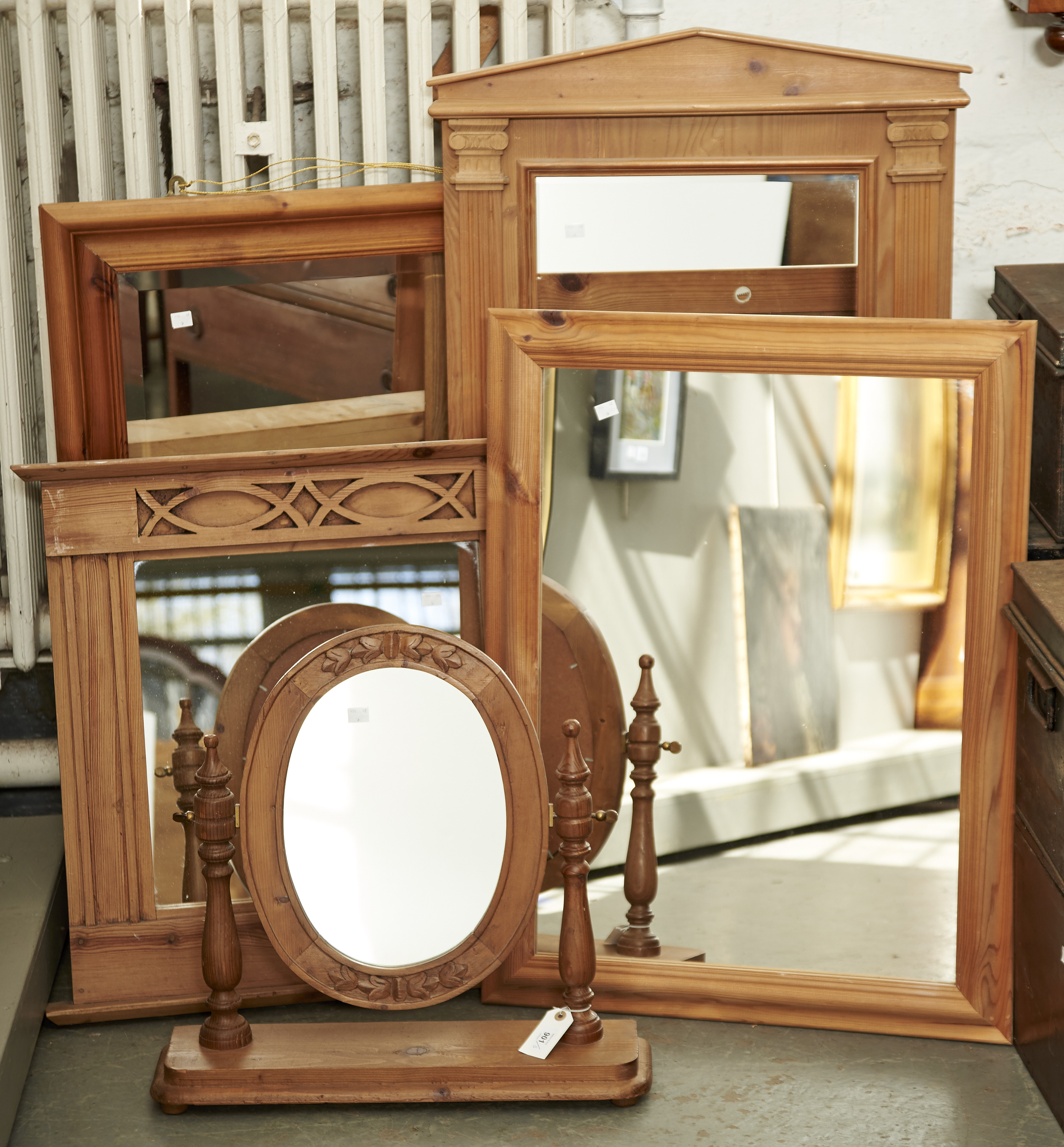 FIVE PINE MIRRORS, TO INCLUDE A TOILET MIRROR WITH OVAL PLATE WITHIN BROAD FOLIATE CARVED FRAME