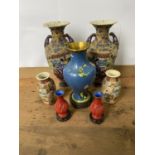 A PAIR OF SATSUMA VASES, ENAMELLED WITH FIGURES IN RESERVES, TWO HANDLED, WITH WAISTED NECKS AND
