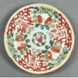 A CHINESE FAMILLE ROSE SAUCER, 19TH C, PAINTED WITH INSECTS AND SHOU CHARACTERS, 13.5CM DIAM Light
