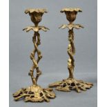 A PAIR OF GILT BRASS CANDLESTICKS IN THE FORM OF GRAPEVINES, LATE 19TH C, NOZZLES, 22CM H Good