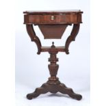 A CONTINENTAL MAHOGANY WORK TABLE, C1850, THE BUTTERFLY VENEERED TOP WITH SERPENTINE FRONT, INCURVED