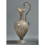 A VENETIAN GLASS CLARET JUG, LATE 19TH C, OF VETRO A RETORTI AND AVENTURINE POLVERI, TRILOBED NECK