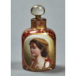 A BOHEMIAN OVERLAY GLASS  SCENT BOTTLE, C1865, IN RED STAINED GLASS GILT WITH TENDRILS, OVERLAID
