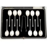 A SET OF TWELVE GEORGE V SILVER SEAL TERMINAL COFFEE SPOONS, BY JOSIAH WILLIAMS & CO, LONDON 1919,