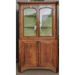 A LARGE GEORGE IV OAK STANDING CORNER CABINET, C1830, FLARED CAVETTO CORNICE ABOVE A PAIR OF