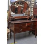 A VICTORIAN WALNUT DRESSING TABLE, THE CENTRAL BEVELLED PLATE WITHIN A FRAME WITH SWAN NECK PEDIMENT