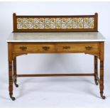 A VICTORIAN OAK WASHSTAND WITH MINTON CHINA WORKS TILED BACK, C1875, THE TILES TRANSFER PRINTED WITH
