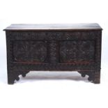 A LATE 17TH C OAK BLANKET CHEST, THE TWIN PLANK TOP WITH MOULDED LIP ABOVE FRIEZE CARVED FOLIATE