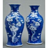 A pair of Chinese blue and white prunus-on-cracked-ice vases, Kangxi mark, Qing dynasty, 19th c,