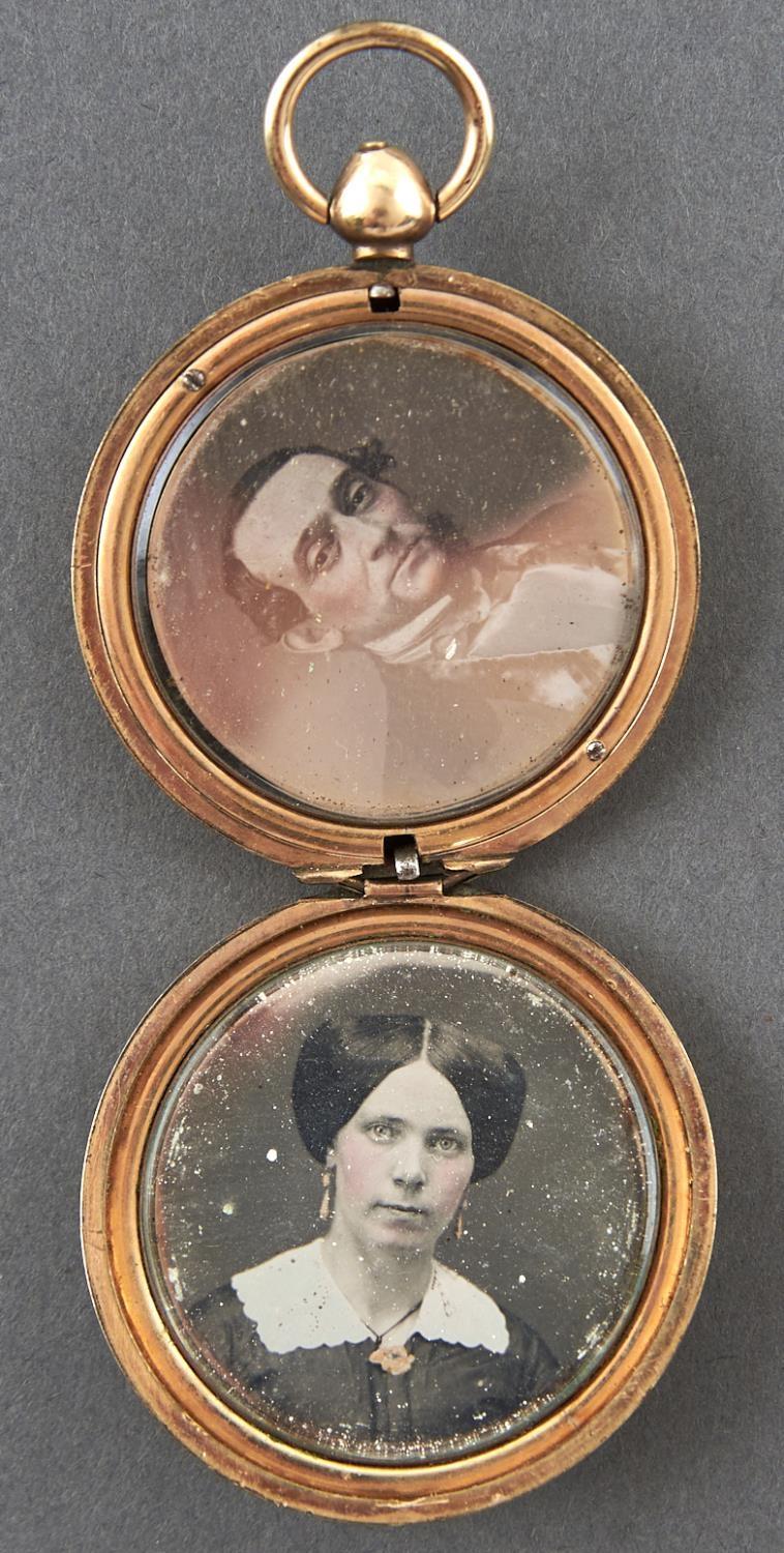 Photographic jewellery. A Victorian gold back-and-front locket containing a pair of daguerreotypes