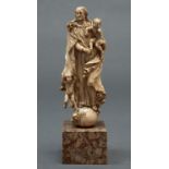 A Portugese ivory carving of St Joseph with the Christ Child, c1700, the Saint's long flowing hair