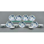 A set of four Japanese blue and white bowls, two covers and seven stands, painted with phoenix and