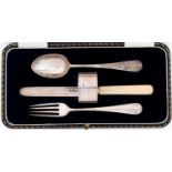 A George V silver child's christening set of spoon, fork, knife and napkin ring, by James Dixon &