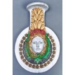 Maritime interest. An Art Deco polychrome, gilt and silvered oak relief ship's insignia as the