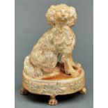 A Derbyshire saltglazed brown stoneware model of a spaniel, Chesterfield, mid 19th c, of honey