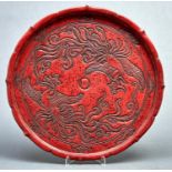 A Japanese Kamakura-bori lacquer tray, second quarter 20th c, carved with a pair of phoenix in