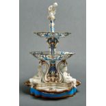 A French porcelain centrepiece, late 19th c, in three tiers mounted with biscuit figures of children