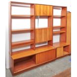 Two G-Plan teak wall units, one with cupboard above shelved recess, fall-flap for drinks flanked