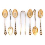 A set of six Victorian blue and white and silver gilt and enamel coffee spoons and pair of sugar