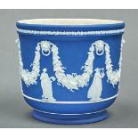 A Wedgwood dark blue jasper dip jardiniere, early 20th c, sprigged with muses and swags, 23cm h,