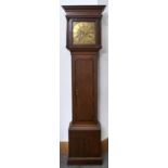 A George III oak longcase clock, the flared cornice Greek key carved above shallow frieze, the