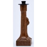 Robert 'Mouseman' Thompson of Kilburn - an oak candlestick of adzed slightly tapered octagonal form,