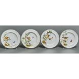 A set of four Minton bone china dessert plates, 1868, painted with different birds and insects on