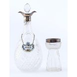 A George V silver mounted cut glass decanter and stopper, double lipped, 27cm h, by John