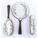 A silver and guilloche enamel brush set, the wavy eau de nil ground painted in polychrome with sweet