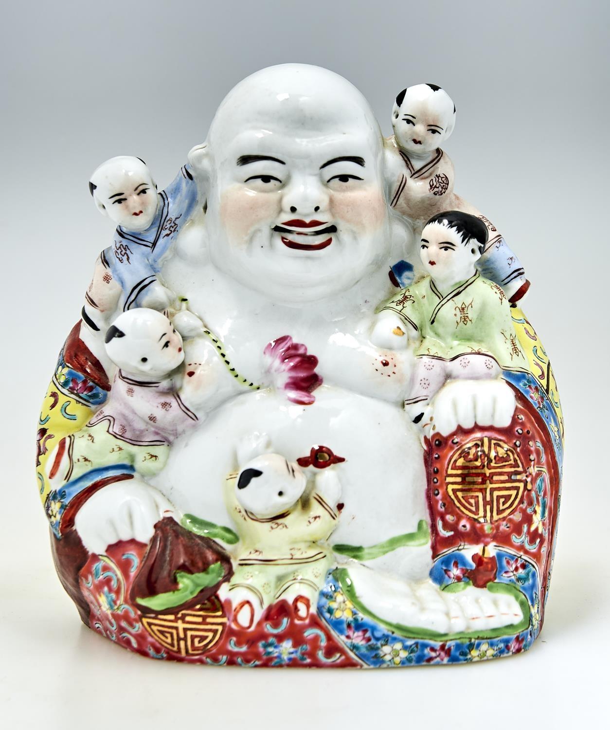 A Chinese famille rose figure of Budai, 20th c, with colourful yellow, blue and red robes with lotus