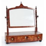 A George IV mahogany dressing mirror with turned uprights, the bow centred base crossbanded in