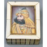 A bone and ivory box, 19th c, the lid inset with an Indian miniature of a maharaja, 11cm l Losses