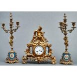 A French giltmetal and Sevres style porcelain inset mantel clock and a pair of similar