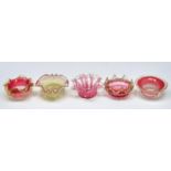 Five cranberry tinted and semi opalescent glass jam dishes, c1900, 12cm diam and circa None damaged