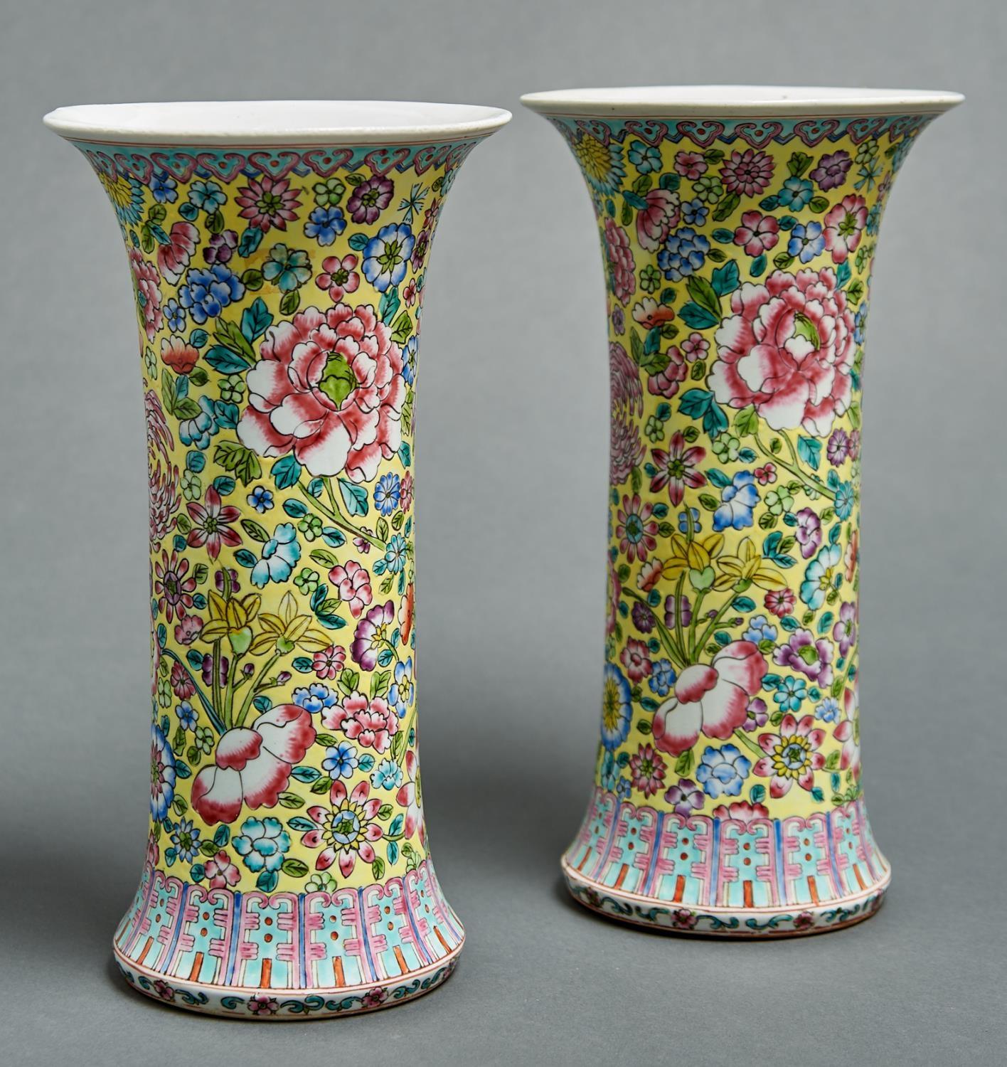 A pair of Chinese yellow ground famille rose sleeve vases, 20th c, 31cm h Good condition