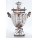 An Austro-Hungarian EPNS samovar, late 19th c, of shield shape with lobed body and upswept handles