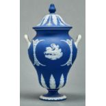 A Wedgwood pear shaped dark blue jasper dip vase and cover, c1880, sprigged with classical figures