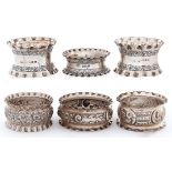 Four Victorian and two Edwardian silver napkin rings, various makers and dates, 3ozs 16dwts Good