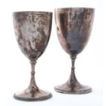 Two George V silver cups, goblet form with beaded foot, 16.5cm and 18cm h, by James Dixon & Sons