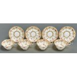A set of four George Jones bone china teacups and saucers, early 20th c, printed and painted with